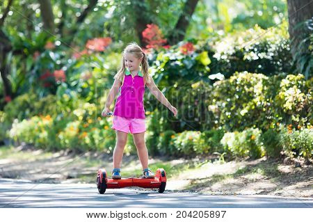 Child On Hover Board. Kids Ride Scooter.