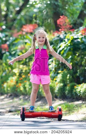 Child On Hover Board. Kids Ride Scooter.