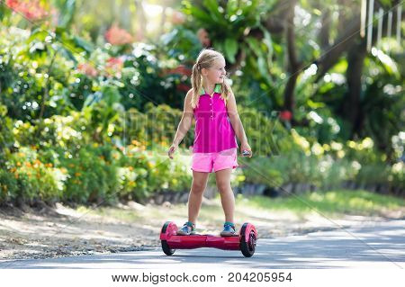 Child On Hover Board. Kids Ride Scooter.