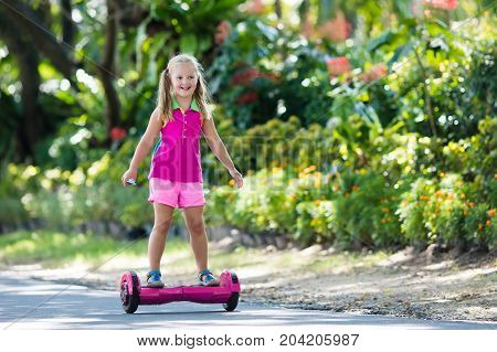 Child On Hover Board. Kids Ride Scooter.