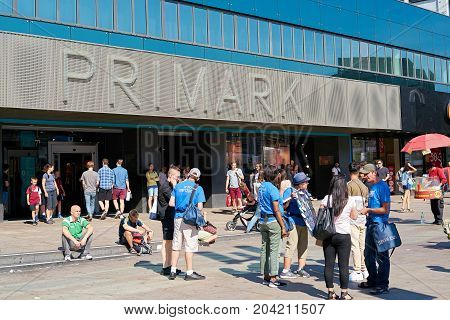 BERLIN, GERMANY - AUGUST 08, 2017: Tourists and residents in front of a branch of the fashion discounter Primark at Alexanderplatz in Berlin