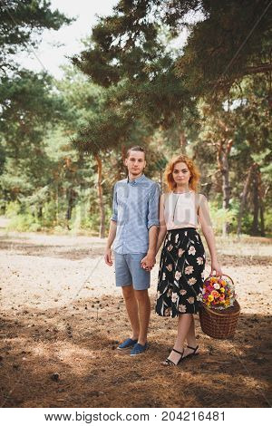 Happiness and love are in the air. Woman and man in the forest. Outdoors concept.