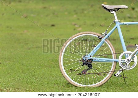 bicycle with wall as blue background.copy space