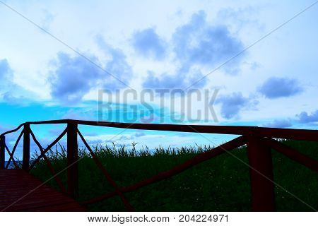 picture took of a bridge ,from the street to the beach