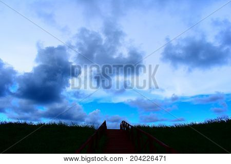 picture took of a bridge ,from the street to the beach