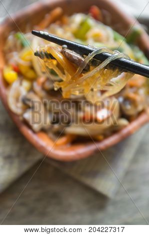 Korean Japchae vegetarian stir fried cellophane noodles with vegetables