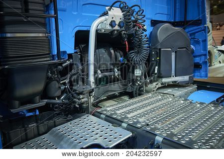 View on car truck back cabin and equipment pneumatic hoses. Metal steps on truck for maintenance. Car truck back. Truck chassis equpments elements devices parts. Truck maintenance platform. MOT