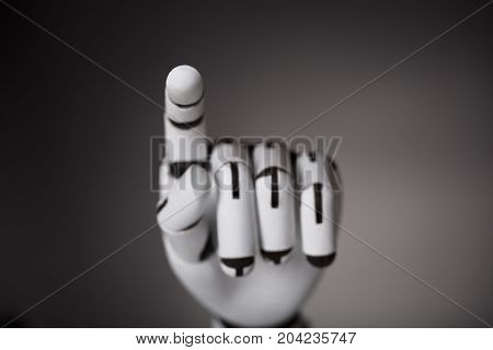 Close-up Of Robotic Hand Touching Transparent Screen