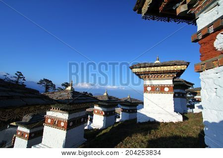 The 108 chortens (stupas) is the memorial in honour of the Bhutanese soldiers with layer of mountains at Dochula Pass on the road from Thimphu to Punaka Bhutan
