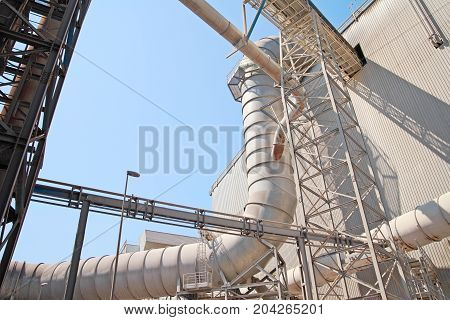 Ductwork Ventilation At Steel Foundry Outdoors, Against The Sky