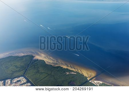Group of yacht sailing on the open sea. Typical landscape on the west coast of Florida in Fort Myers. Aerial view of the sea and the beautiful beaches of Florida.