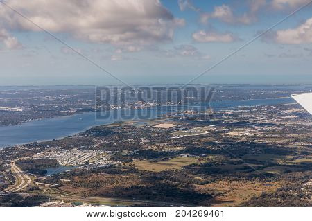 Aerial view of city Bradenton Florida. Approach to land at the airport in St. Petersburg. Manatee River Florida