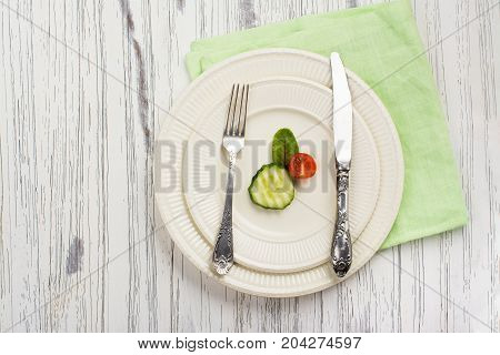 Small portion of food. Anorexia or unhealthy diet concept. Top view