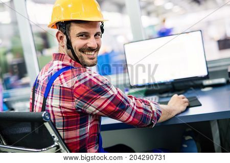Supervisor doing quality control and pruduction check in metal factory