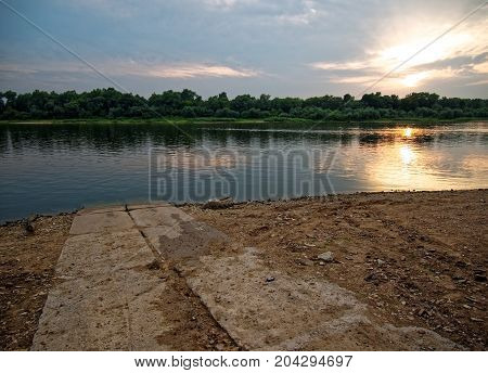 road of concrete slabs suitable to the river, Russia