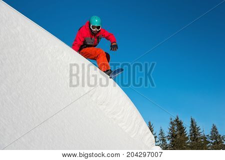 Shot Of A Snowboarder Riding On Dangerous Slope On Sunny Winther Day In The Mountains Copyspace Extr