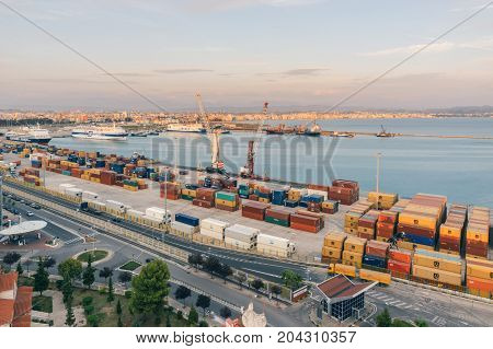 ALBANIA DURRES - September 22 2015: view from above to the port of Durres in the Adriatic Sea. A platform for containers surrounded by tower cranes for unloading. In the port there are tourist cruise liners and tankers for cargo transportation.