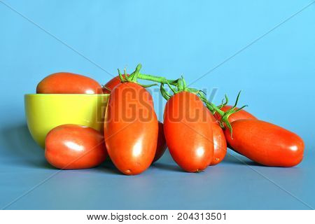 Tomatoes San Marzano, Campania, italy

Group of tomatoes San Marzano, bunch cluster, still life on gray-blue background