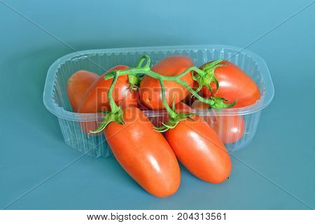 Tomatoes San Marzano, Campania, italy

Group of tomatoes San Marzano, bunch cluster, still life on gray-blue background