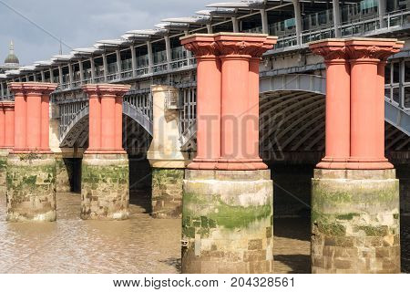Red Pillars In The River Thames Between Blackfriars Road Bridge And Blackfriars Railway Bridge