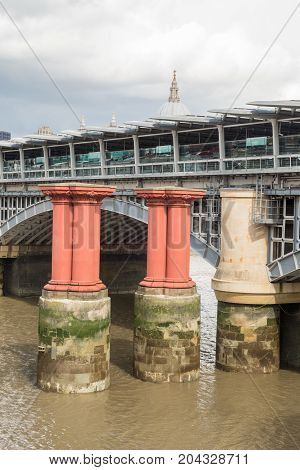 Red Pillars In The River Thames Between Blackfriars Road Bridge And Blackfriars Railway Bridge