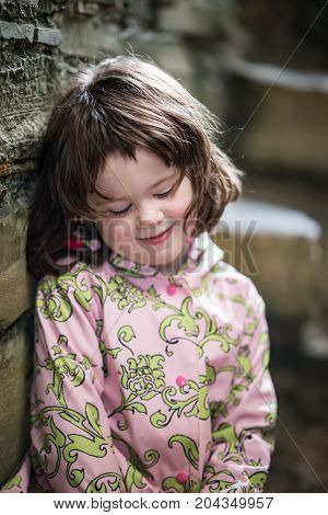 View of Young little girl portrait looking and smiling at the camera.