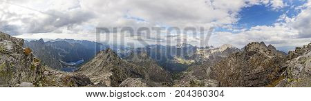 View on high Tatra Mountains from Rysy mountain with dramatic cloudy sky