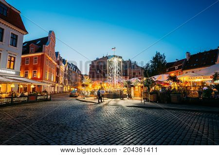 Riga, Latvia - July 1, 2016: Open Air Leisure Venue Recreation Center Egle In Evening Or Night Illumination In Old Town On Kalku Street.