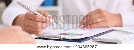 Businesswoman Holding A Silver Pen In Her Hand