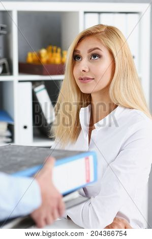 Female Employee Show Pack Of Documents To Manager