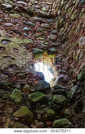 very old Kazdangas church wall of stones.