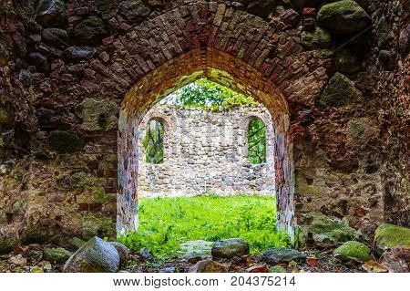 very old Kazdangas church wall of stones.