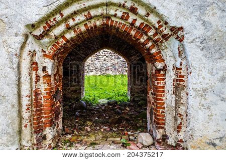 very old Kazdangas church wall of stones.