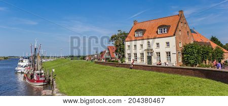 GREETSIEL, GERMANY - JULY 18, 2017: Panorama of the historic harbor of Greetsiel, Germany