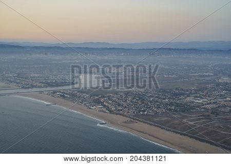 Sunset View Of Sky From A Window Seat In An Airplane