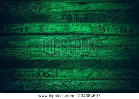 Old green vintage wood. Dark green vintage wood texture and background. Abstract texture and background for designers. Old vintage wood paint in dark green. Rough green wood background and texture