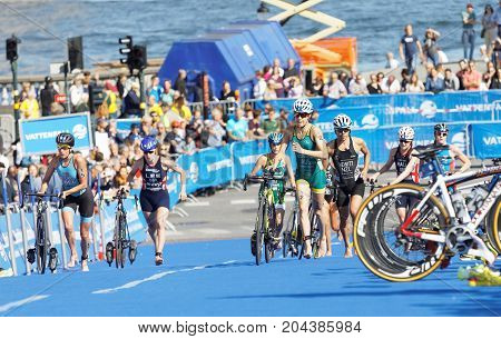 STOCKHOLM - AUG 26 2017: Female triathlete Gentle (AUS) and Hewitt (NZL) and competitors running in the transition zone in the Women's ITU World Triathlon series event August 26 2017 in Stockholm Sweden