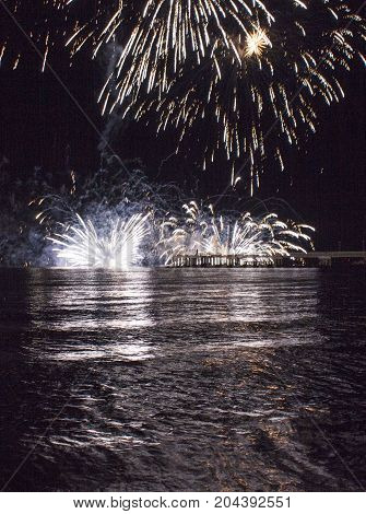MARINA DI MASSA, ITALY - AUGUST 22 2015: Firework by the sea in Marina di Massa Italy from its famous pier
