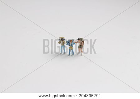 Min Hikers With Backpacks On The White Baord