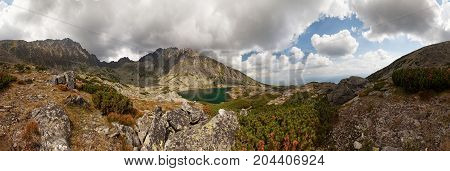 Panorama of valley with beautiful alpine lake ander highest peak of Tatra Mountains - Gerlachovsky stit