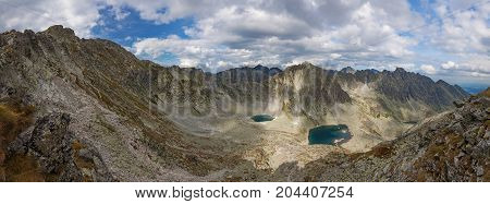 Alpine lake Vysne Wahlenbergovo pleso, with a great view on High Tatra mountains.