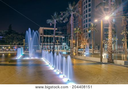 ALBANIA DURRES - September 22 2015: Evening central square with fountains colorful illumination