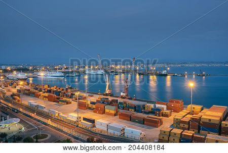 ALBANIA DURRES - September 22 2015: view from above to the port of Durres in the Adriatic Sea. A platform for containers surrounded by tower cranes for unloading. In the port there are tourist cruise liners and tankers for cargo transportation.