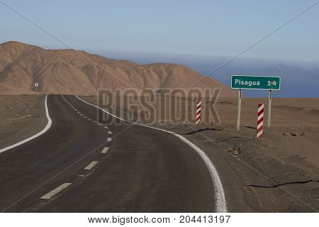 Road through the Atacama Desert to the historic coastal town of Pisagua in the Tarapaca Region of northern Chile.