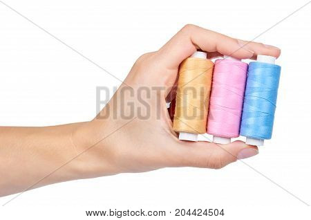 Spool Of Thread In Hand Isolated On White Background