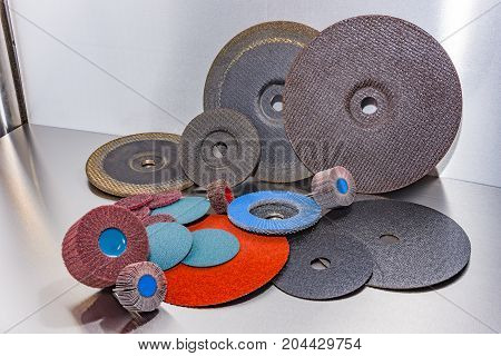 A pile of color abrasive sandpaper for metal working sandpaper for metal working