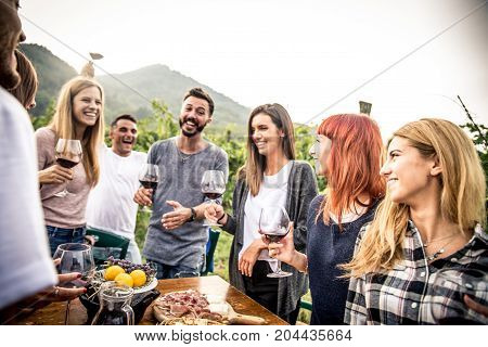 Group of friends at restaurant outdoors - People having dinner in a home garden