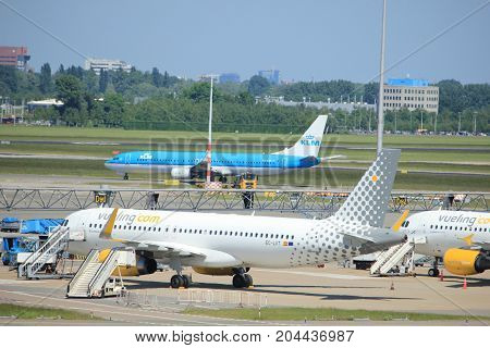 Amsterdam The Netherlands - May 26th 2017: EC-LVT Vueling Airbus A320-200 parked at tarmac at Schiphol International Airport