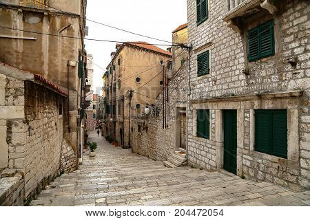Tourist city by the Adratic sea - Sibenik, Croatia. The old stones, narrow street and stairs.
