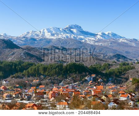 View of Lovcen mountain  and Cetinje town on a sunny winter day. Montenegro.